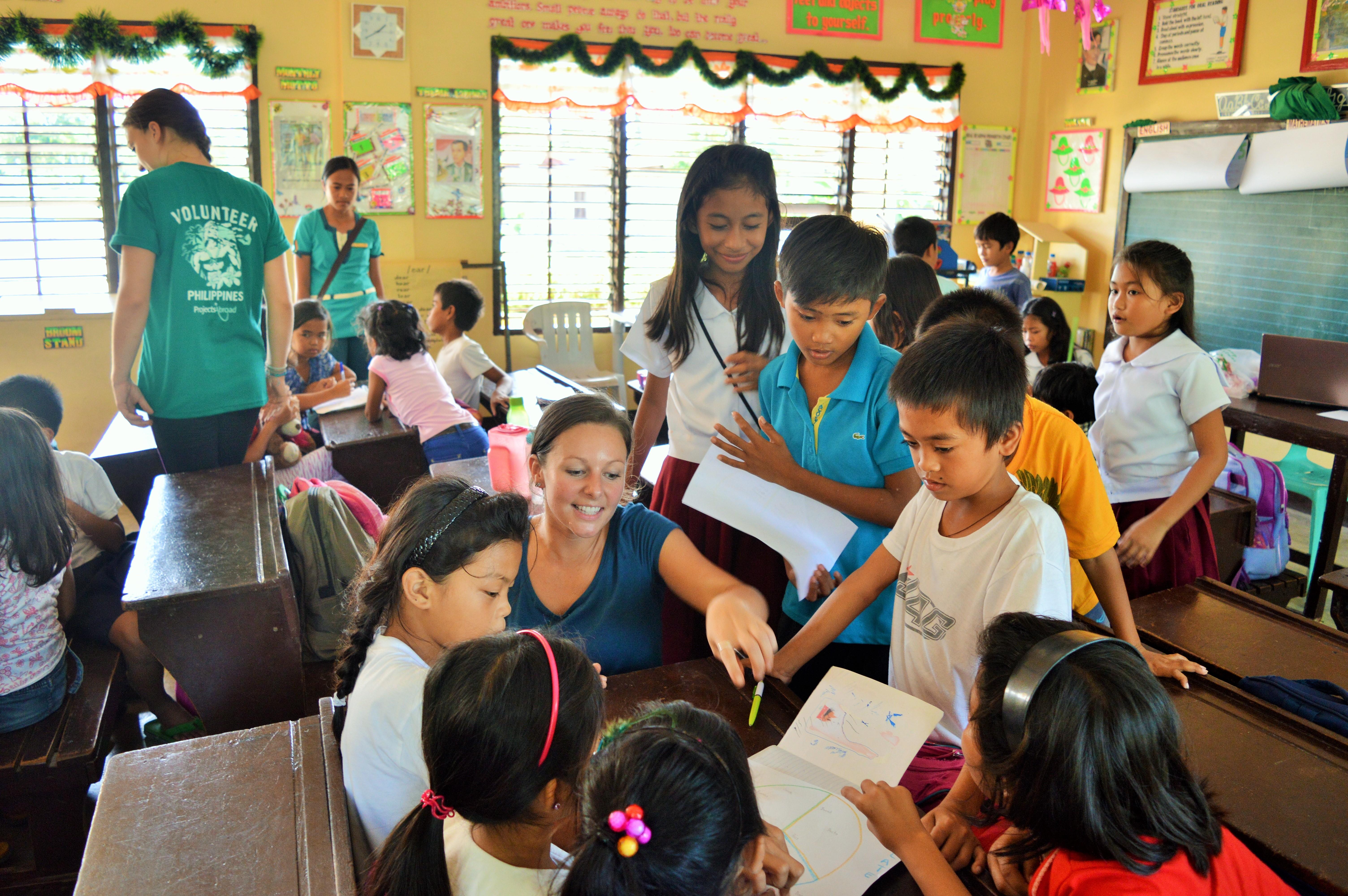 Students in the Philippines learn the English words for different food at one of our volunteer teaching placements Projects Abroad volunteer teaching English nutrition words in the Philippines